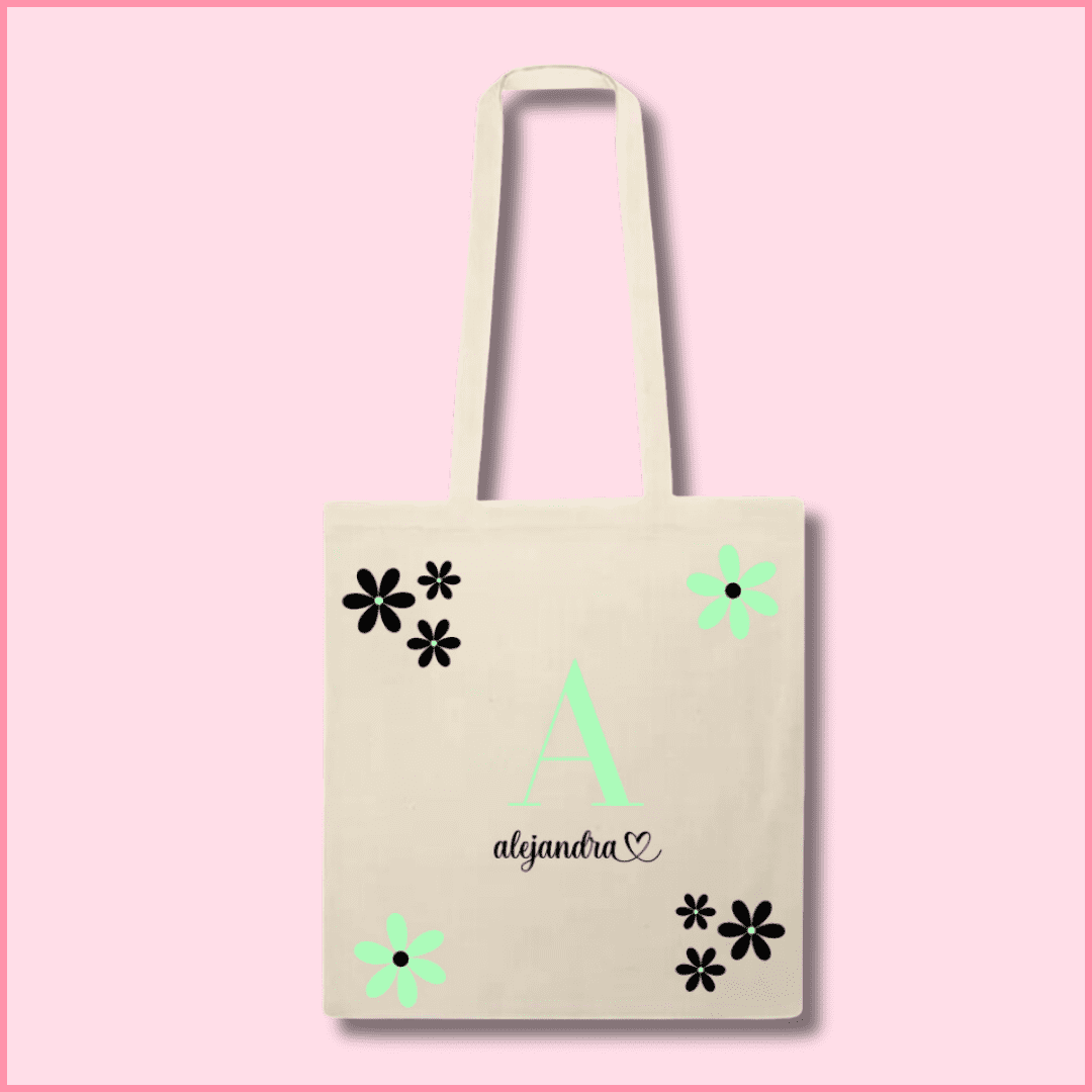 Tote bag de algodón beige personalizada con la inicial y el nombre y flores negras y verdes