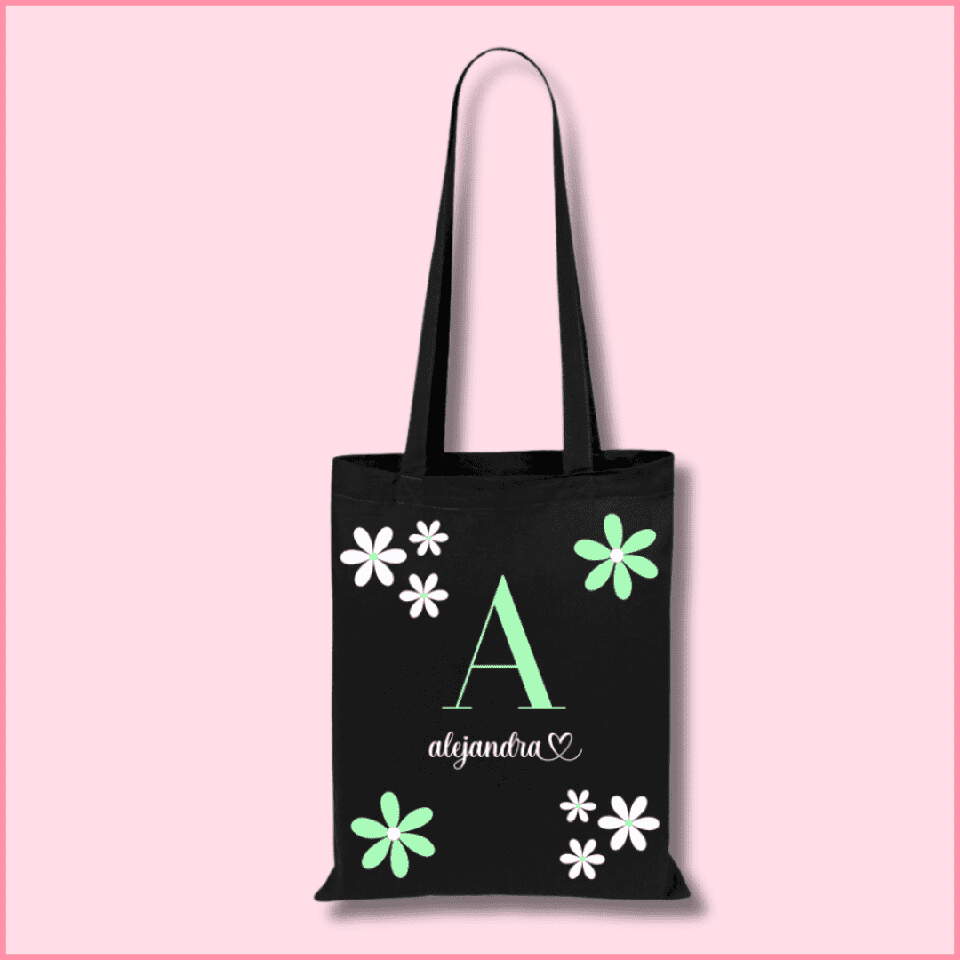 Tote bag de algodón negra personalizada con la inicial y nombre y flores blancas y verdes