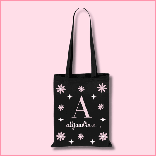 Tote bag de algodón negra personalizada con la inicial y nombre y flores de color rosa