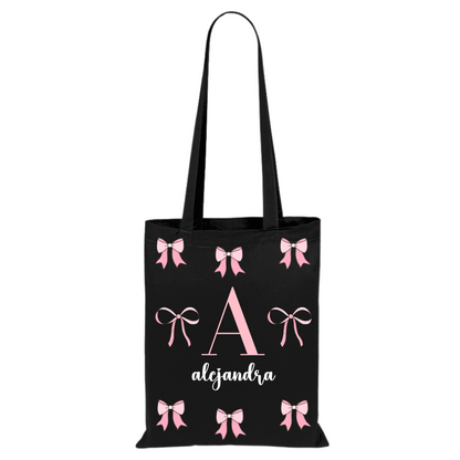 Tote bag de algodón negra con inicial y nombre personalizado y diseño de lazos rosas